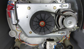 Drive belt tension adjustment and replacement